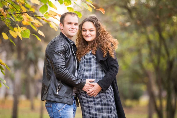 Happy Pregnant Couple Autumn Background — 图库照片