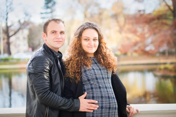 Happy Pregnant Couple Autumn Background — 图库照片