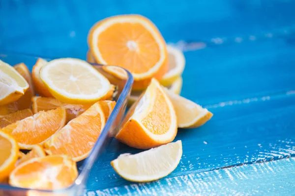 citrus fruits  orange and lemons on blue background