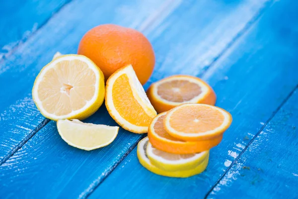 citrus fruits  orange and lemons on blue background