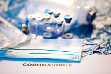 Coronavirus aşısı şişesi mavi tıbbi geçmiş