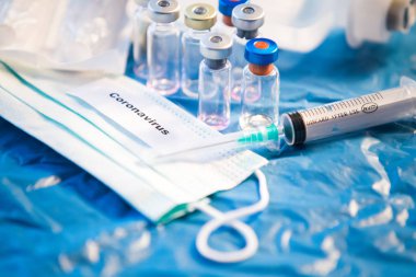 Coronavirus aşısı şişesi mavi tıbbi geçmiş