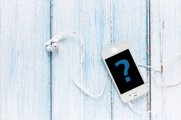 smartphone with earphone and question symbol on screen