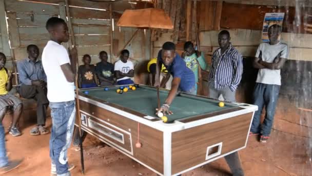 A young men playing billiards in the hut — Stock Video