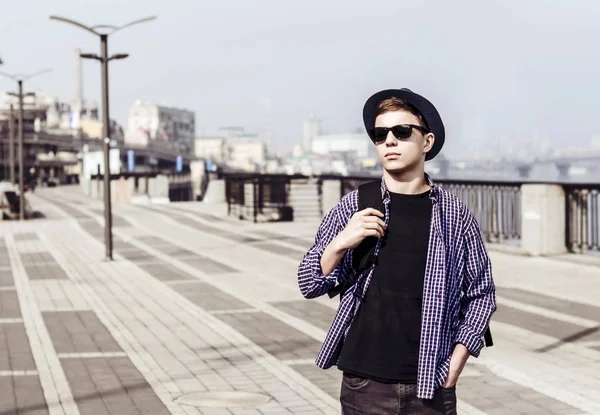 Stylish young man on the city embankment — Stock Photo, Image