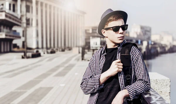 Stylish young man on the city embankment — Stock Photo, Image