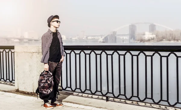 Stylish young man on the city embankment — Stock Photo, Image