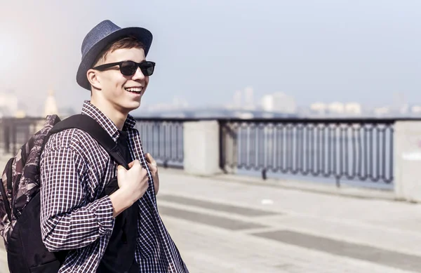 Stylish young man on the city embankment — Stock Photo, Image