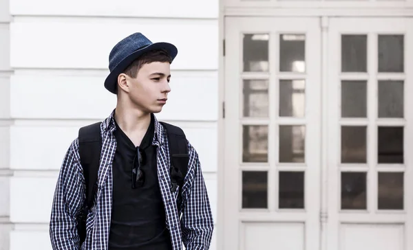 Stylish young man near the doors of the building — Stock Photo, Image