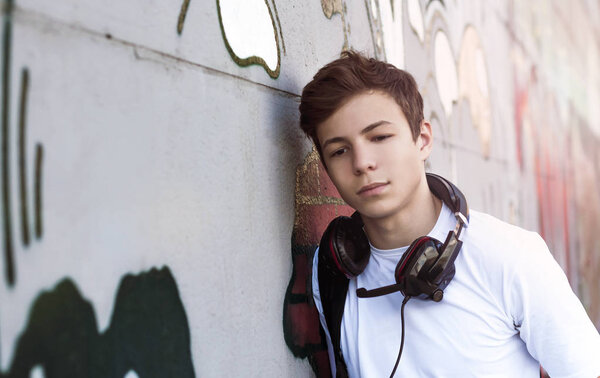 Young man with headphones listening to music