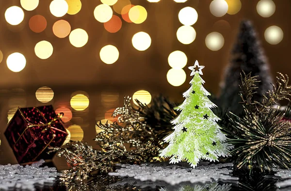 Decorative Christmas tree on a background of lights — Stock Photo, Image