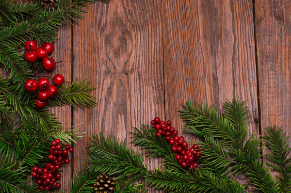 Christmas fir tree on wooden background