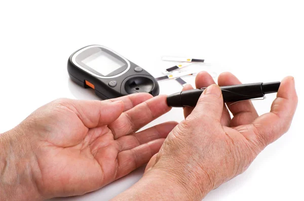 Closeup female hands using glucometer scanner — Stock Photo, Image