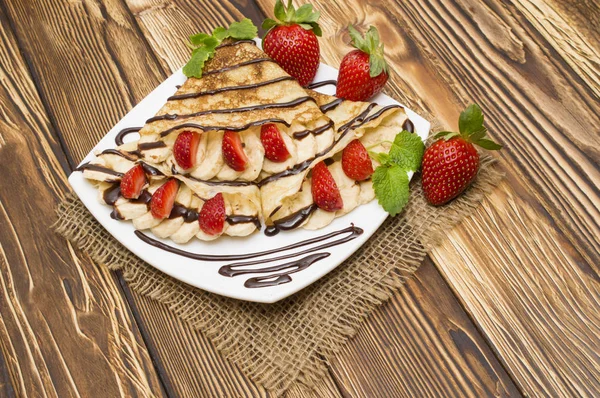 Crepes with Banana and strawberries — Stock Photo, Image