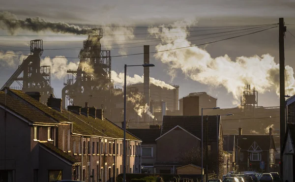 Editorial PORT TALBOT, UK - JANUARY 04, 2020: The houses of Port Talbot and the emissions of the TATA Steel works that provides employment for the townsfolk.