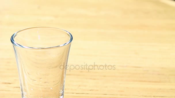 Blue liqueur poured into a glass — Stock Video