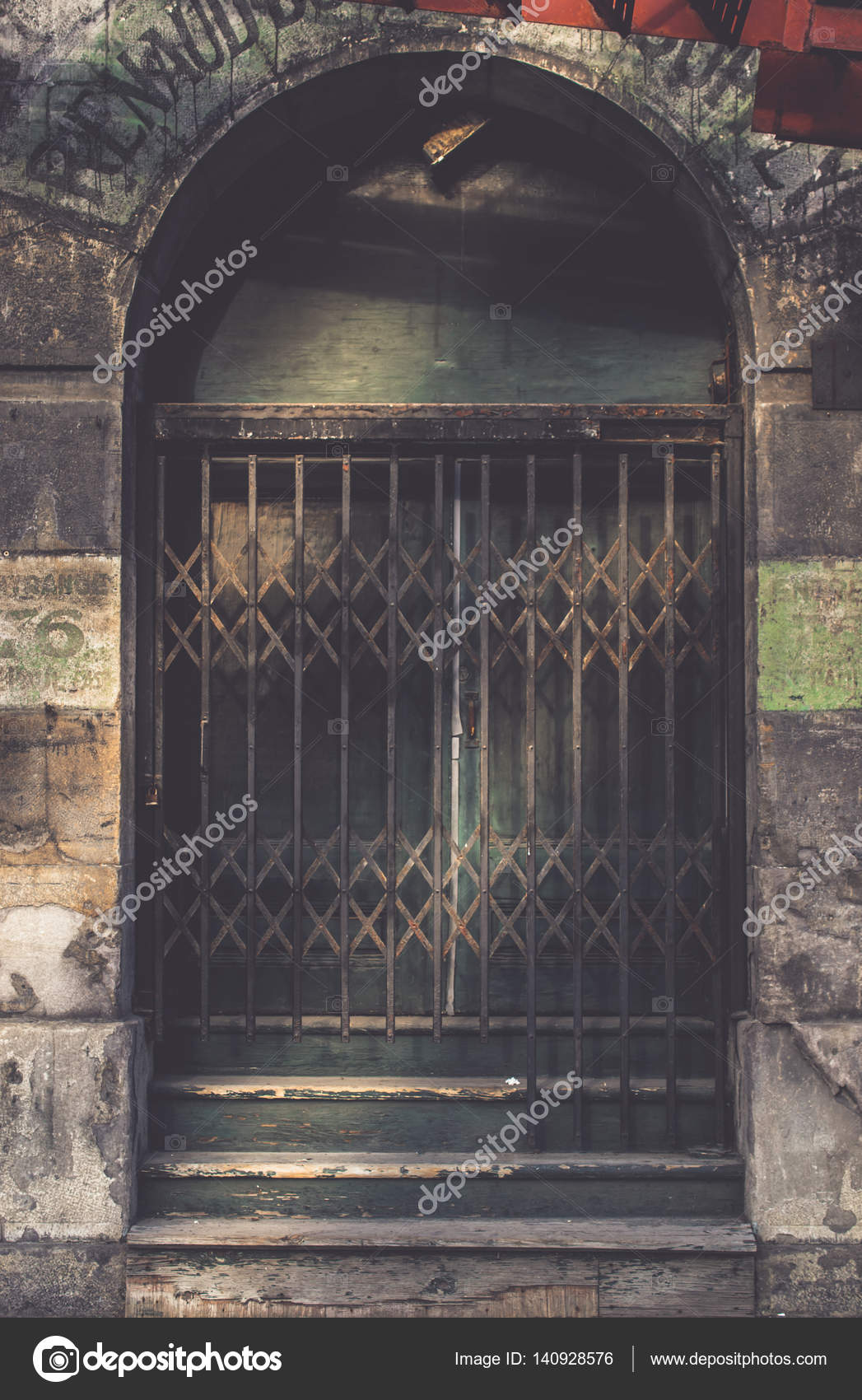 Vintage Sliding Barred Door In The Dark Tone For Interior Or Ex