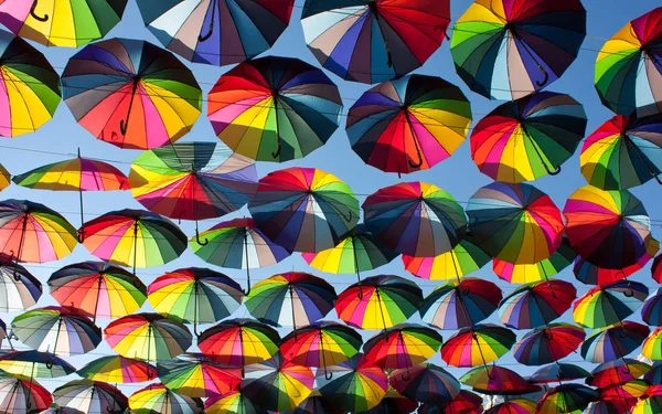 Multi-colored umbrellas in the sky