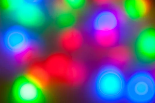 Colorful garlands of lights out of focus. — Stock Photo, Image