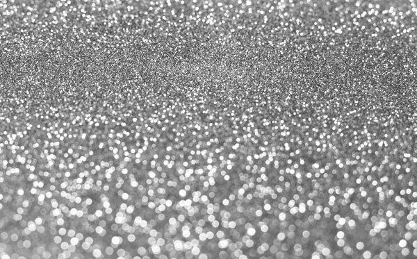 Серебряный фон размытого блеска
