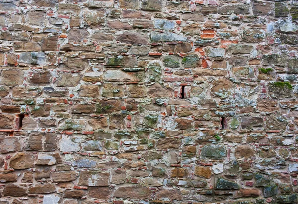 De natuurlijke textuur van de steen, baksteen bruin, groen, rood muur backg — Stockfoto