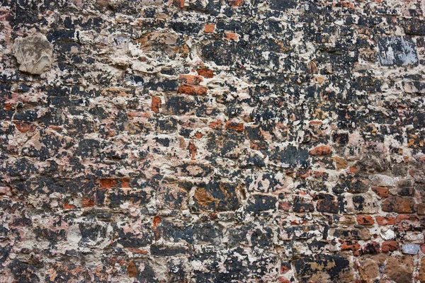 Nero, rosso, vecchio muro di mattoni — Foto Stock