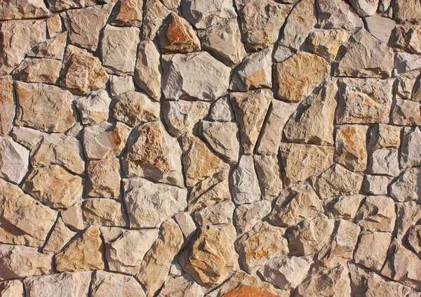 Achtergrond van bruine, rode stenen in een chaotische manier, concrete t — Stockfoto