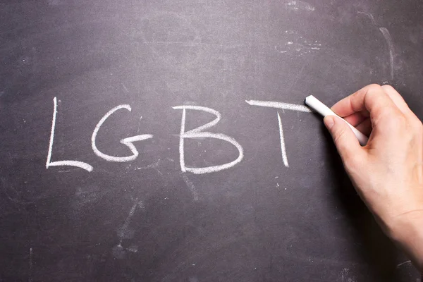 Palabra LGBT está escrito tiza en la pizarra — Foto de Stock