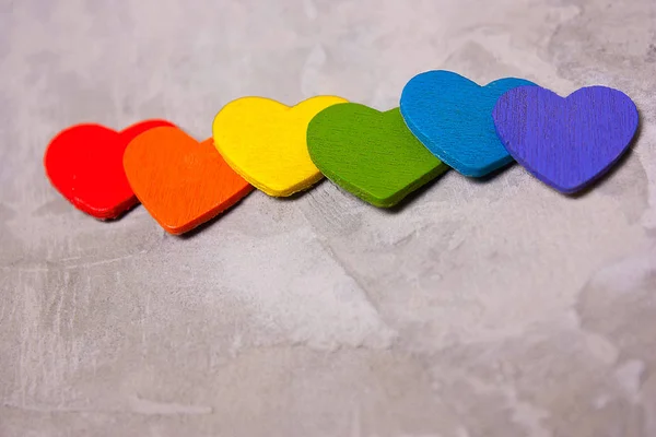 Wooden hearts of the color of the rainbow . symbol of LGBT — Stock Photo, Image