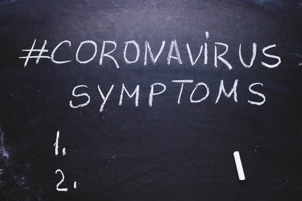 Coronavirus hashtag on chalk board. Epidemic concept