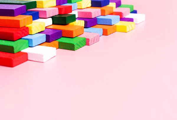 Concept creative, logical thinking, art,Creativity inspiration, order, business organization. Colored dominoes on a pink background