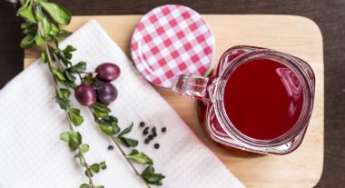 Berry juice in glass on chopping board flat lay clipart