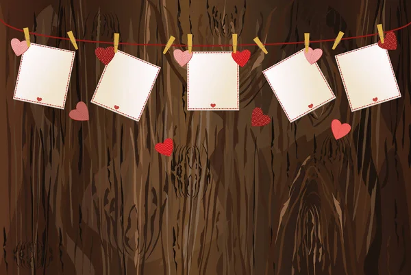 Κόκκινες καρδιές και κενά χαρτί με μια εικόνα που κρέμεται από ένα σκοινί. V — Διανυσματικό Αρχείο