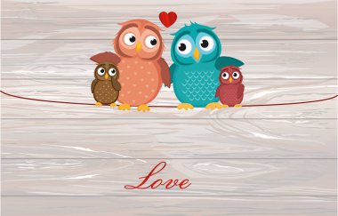 Güzel çift oturma baykuş çocuk owlet iple üzerinde. Aile