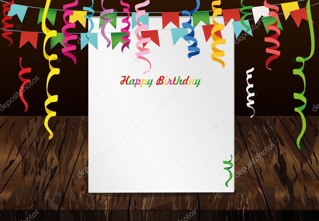 Greeting card with colorful flags and confetti on wooden background