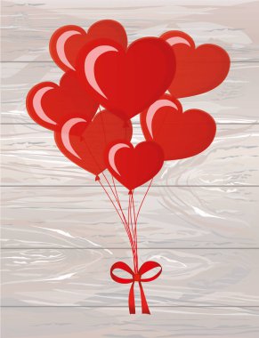 Sargılı şerit ve yay ile kalp şeklinde balonlar