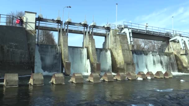 Weir On Morava River, Hydro-electric Power Station, in winter frozen water with ice and icicles snow, people sky blue, Europe — Stock Video