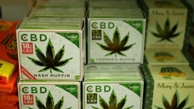 PRAGUE, CZECH REPUBLIC, SEPTEMBER 9, 2019: Cannabis cookies shop store Prague, hash muffin strong, packaged hemp cannabidiol CBD biscuit or cracker seeds and in relieves pain, leaf symbol green clipart