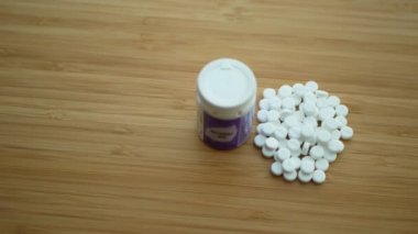 OLOMOUC, CZECH REPUBLIC, FEBRUARY 11, 2020: Homeopathy alternative medicine tablets pills capsule and globules white without side effects, drug extracts homeopathic herbal bottle tube plastic