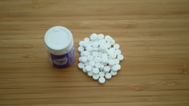 OLOMOUC, CZECH REPUBLIC, FEBRUARY 11, 2020: Homeopathy alternative medicine tablets pills capsule and globules white without side effects, drug extracts homeopathic herbal bottle tube plastic — 图库视频影像