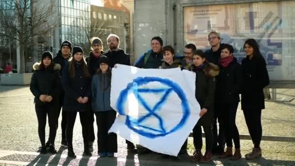 OLOMOUC, CZECH REPUBLIC, JANUARY 10, 2019: Extinction rebellion activist banner symbol circle hourglass is warning, men women people, demonstration activists activism rebels — Wideo stockowe