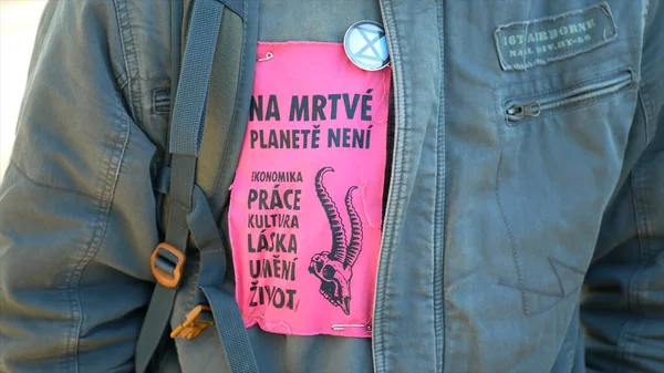 OLOMOUC, CZECH REPUBLIC, FEBRUARY 10, 2019: Extinction rebellion people activist jacket applique there is no economy, labor, dead planet symbol circle planet climate change — Stockfoto