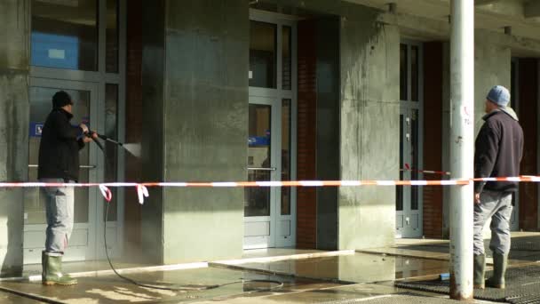 OLOMOUC, CZECH REPUBLIC, MARCH 13, 2020: Cleaning washing entrance disinfection disinfectant against coronavirus risk covid-19 gel, workers train station public transport disinfect disinfected — Stock Video