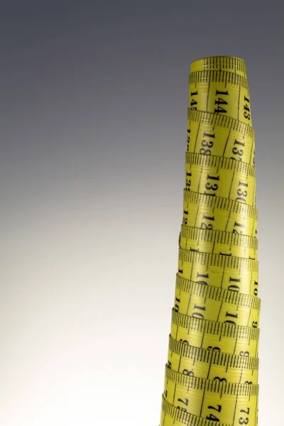 Rolou fita métrica amarela velha — Fotografia de Stock