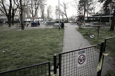 Closed playground during covid-19 crisis on a cloudy day in Zagreb,croatia clipart
