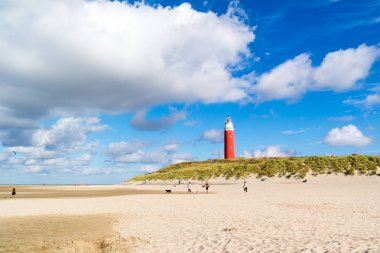 Lighthouse and beach of De Cocksdorp on Texel island, Netherland clipart