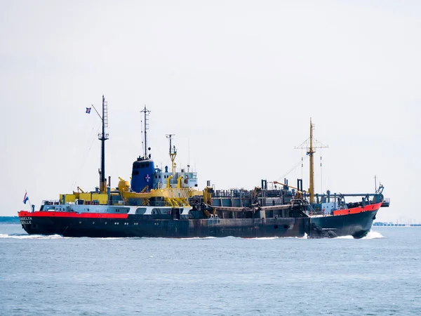 Trailing suction hopper dredger ship unloading at North Sea near — Stock Photo, Image