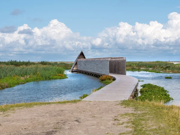 Boardwalk path to bird hide on manmade island Marker Wadden in M