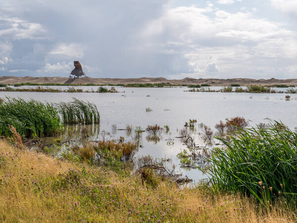 Watchtower and marshes on manmade artificial island Marker Wadde