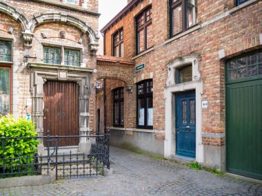 Street scene of corner Walplein and Stoofstraat in old town of Bruges, Belgium